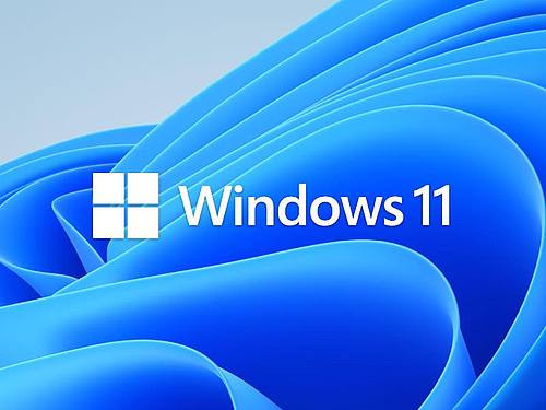 Das Windows 11-Logo mit blauem Hintergrund. Foto: Microsoft/PA Media/dpa