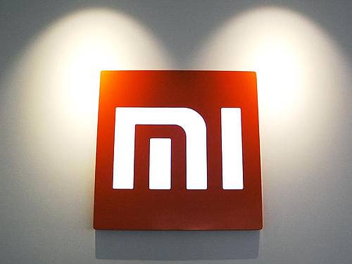 Das Logo des chinesischen Smartphone-Anbieters Xiaomi in der Firmenzentrale in Peking. Foto: picture alliance / dpa