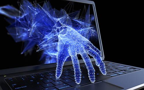 Hand kommt aus Laptop-Bildschirm