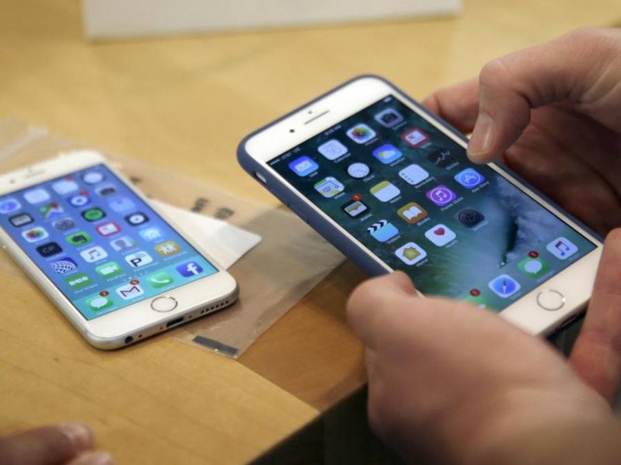 iPhones in einem Apple-Store: Qualcomm will die iPhone-Produktion in China stoppen. Foto: Kiichiro Sato